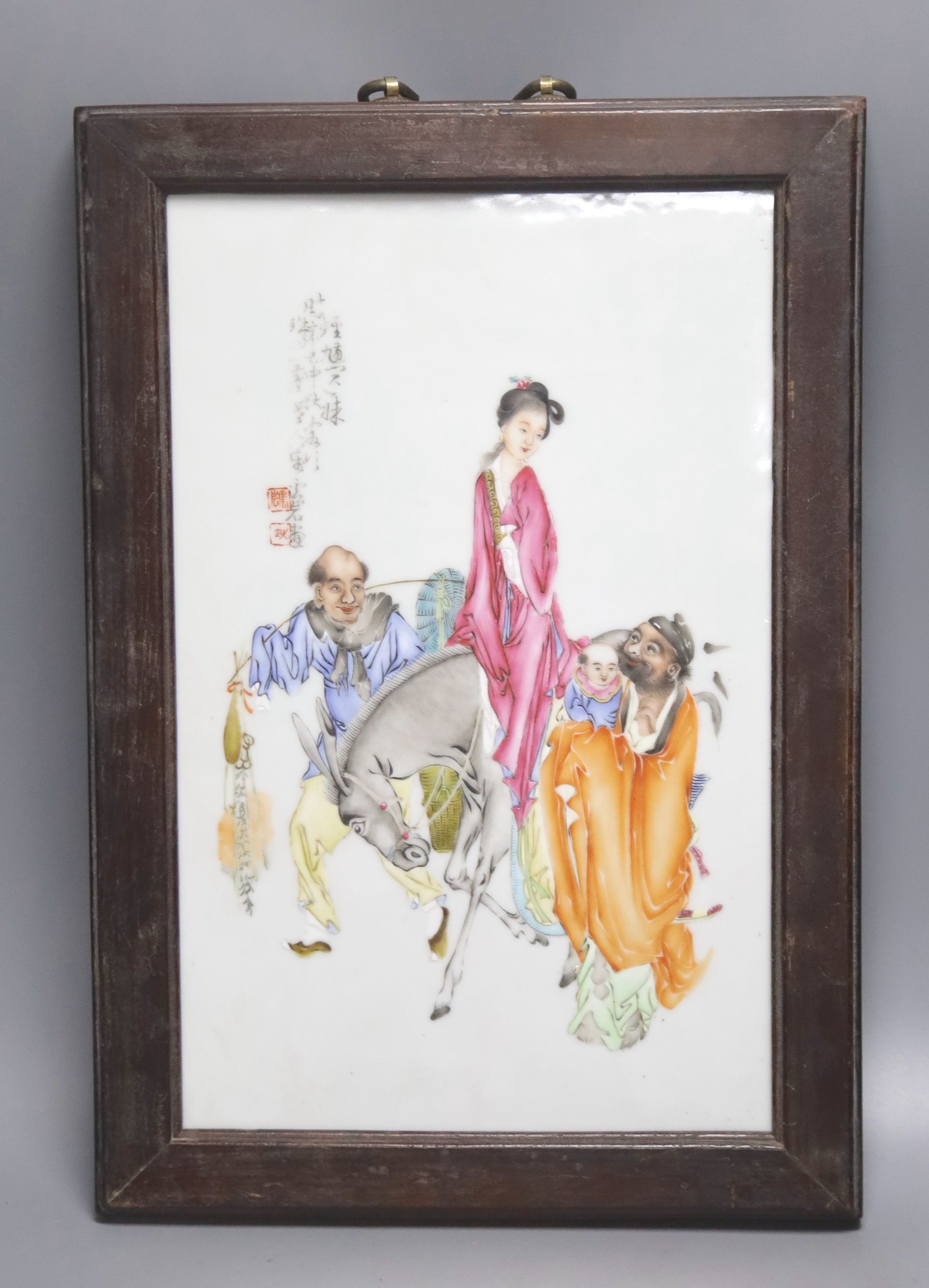 A Chinese framed poreclain plaque, painted with figures and script, height 44cm incl. frame